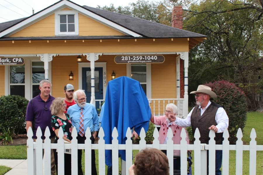 Descendants of the Dean family unveil the marker with resident historian Celeste Graves, second from right, and Montgomery County Precinct 2 Commissioner Charlie Riley, right. (Anna Lotz/Community Impact Newspaper)