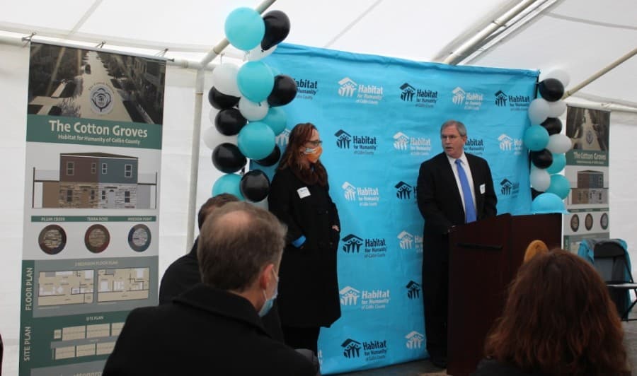 Habitat for Humanity of Collin County CEO and President Celeste Cox, left, and McKinney City Council member Charlie Philips, right, address the audience at the Cotton Groves groundbreaking ceremony Oct. 27. (Miranda Jaimes/Community Impact Newspaper)