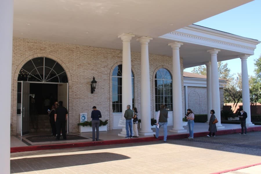 About half a dozen voters waited in line outside the Sugar Creek County Club on Election Day. (Claire Shoop/Community Impact Newspaper)