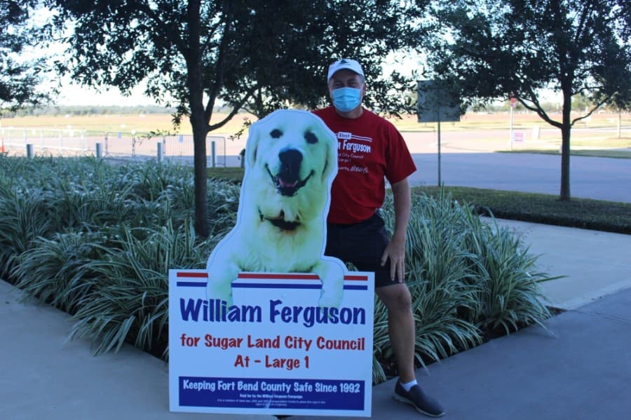 Williamson Ferguson, Sugar Land City Council At-Large Position 1 candidate, greeted voters at the Smart Financial Centre. (Claire Shoop/Community Impact Newspaper)
