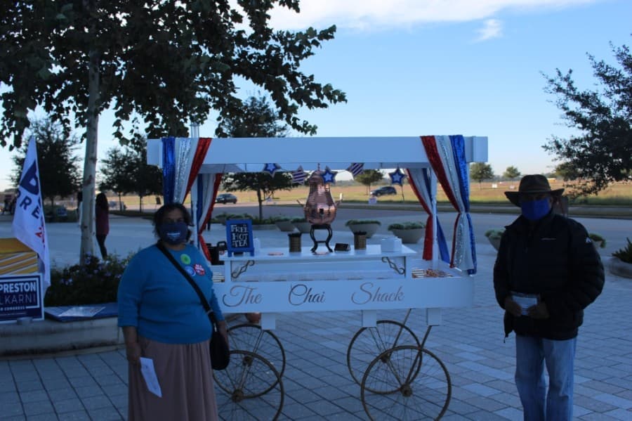 Representatives with Democrat Sri Preston Kulkarni's campaign for the U.S. House of Representatives District 22 seat were handing out tea to voters at the Smart Financial Centre. (Claire Shoop/Community Impact Newspaper)