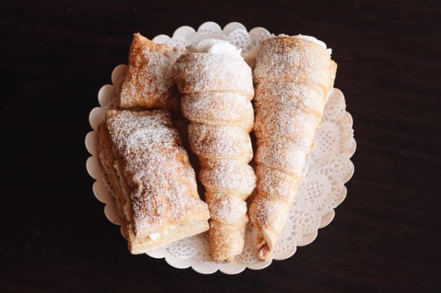 


Treats include Napoleons ($1) and cream horns ($2). (Courtesy Cakes N’ Mor)