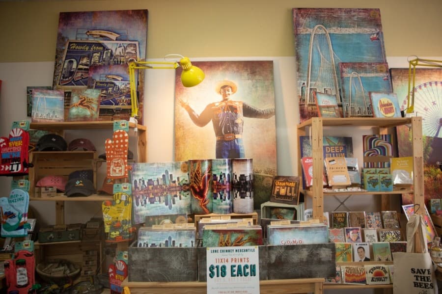 Owner Annie Holland sells her landmark photography in the store. (Liesbeth Powers/Community Impact Newspaper)