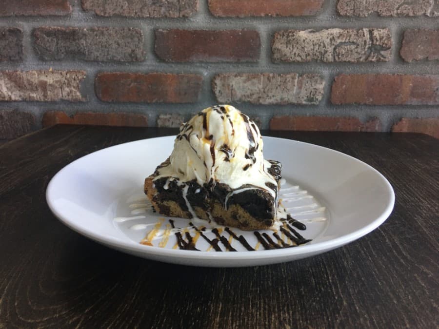 Lowens Brownie, $7.95: A brownie, Oreos, and a chocolate chip cookie served with vanilla bean ice cream. (Haley Morrison/Community Impact Newspaper)