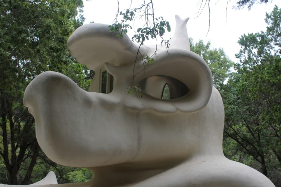 The second-floor loft, which resembles a dragon's head, houses a day bed and oval windows.