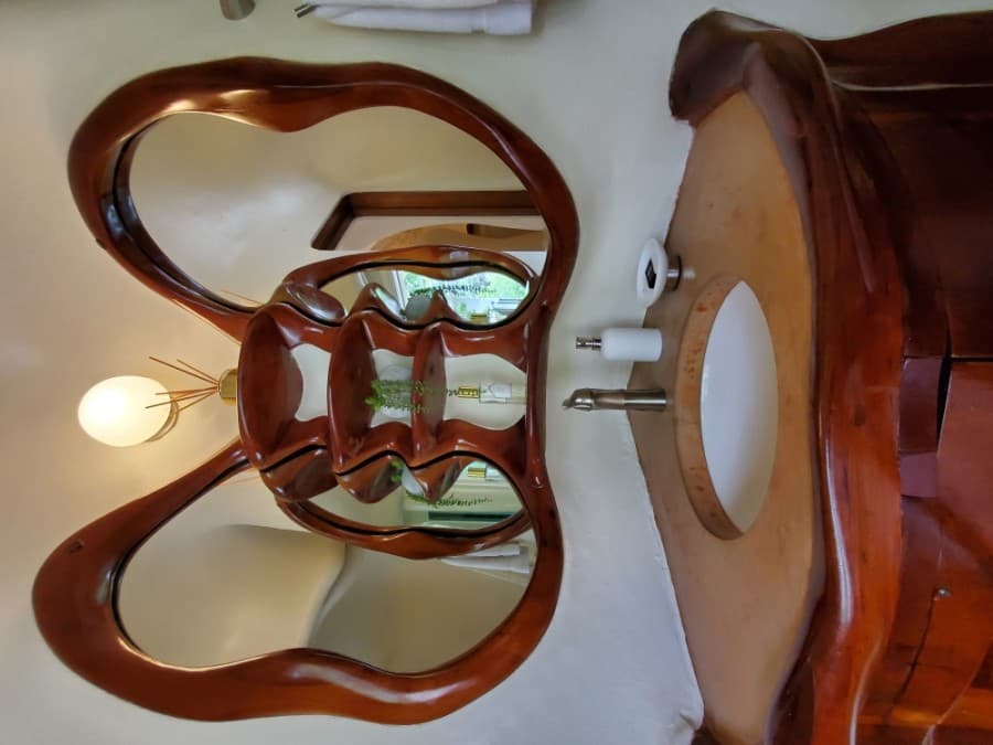 


The bathroom vanity, with cherry wood accents, resembles a butterfly.