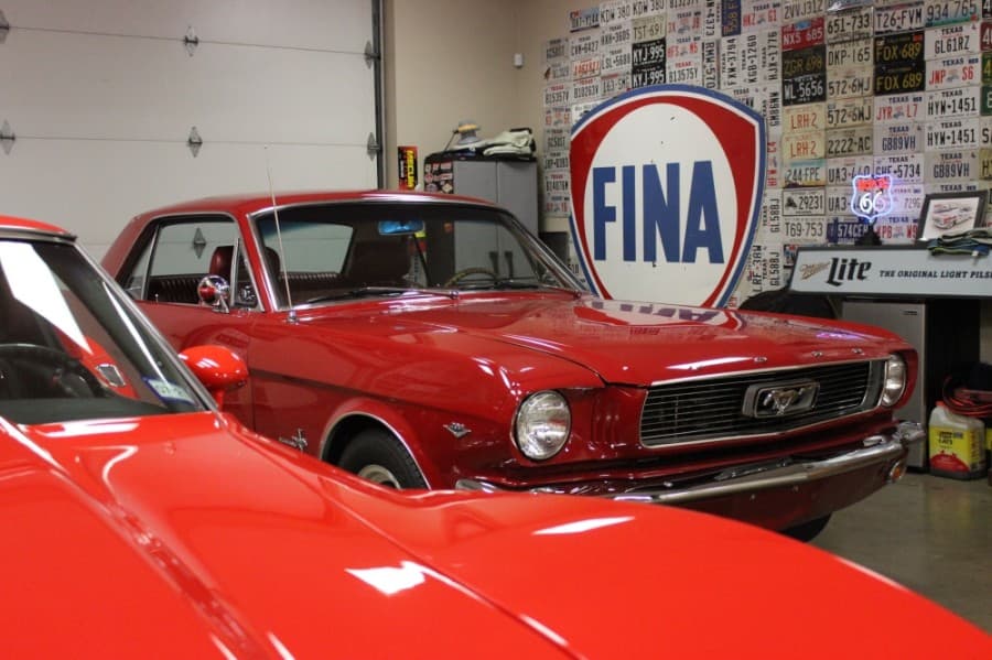 The selection at Garrett Classics includes classic muscle cars like this Ford Mustang. Dave and Maris Garrett moved their classic car business to Lewisville three years ago. (Daniel Houston/Community Impact Newspaper)