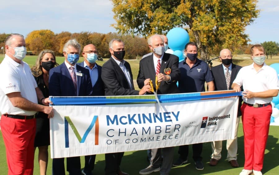 Officials with the Salesmanship Club of Dallas and the McKinney Chamber of Commerce cut the ribbon on the AT&T Byron Nelson Tournament's planned move to TPC Craig Ranch in McKinney. (William C. Wadsack/Community Impact Newspaper)