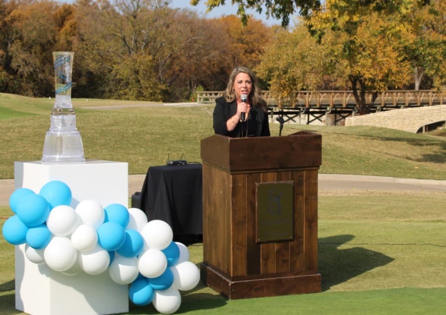 Lisa Hermes, executive director of the McKinney Chamber of Commerce, speaks during a ribbon-cutting event for the AT&T Byron Nelson Tournament on Nov. 10. (William C. Wadsack/Community Impact Newspaper)