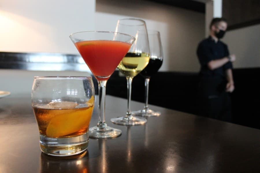 Hillside Fine Grill serves a variety of alcoholic beverages from its bar, including (from left) the Woodford Old Fashioned, Hillside Martini, Savignon Blanc wine and Juggernaut Hillside cabernet. (Daniel Houston/Community Impact Newspaper)