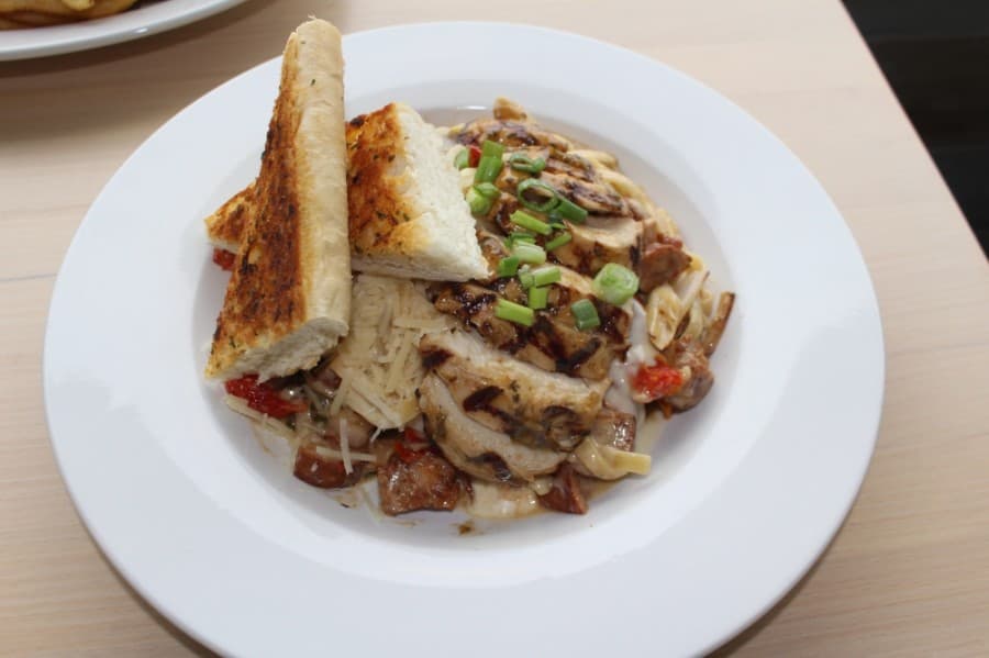 Mardi Gras Pasta ($13.99) features fettucini, sausage and grilled chicken. (Eva Vigh/Community Impact Newspaper)