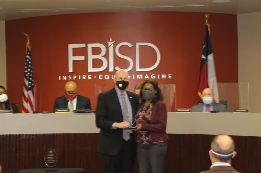 Allison Drew was recognized for her 18 months of service on the board of trustees. (Claire Shoop/Community Impact Newspaper) 