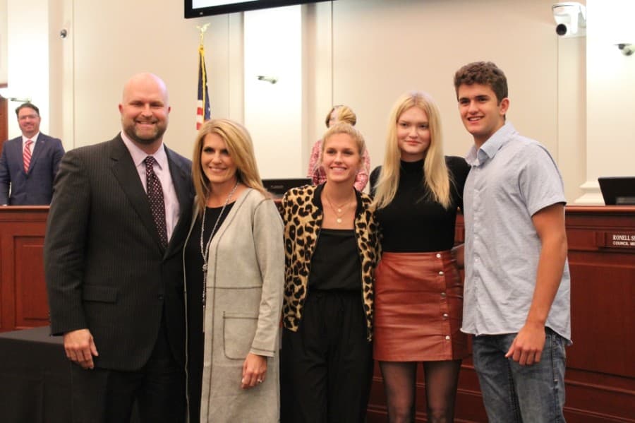 Council Member Randy Williamson poses with his family in the Southlake City Council Chambers on Nov. 17. (Sandra Sadek/Community Impact Newspaper)