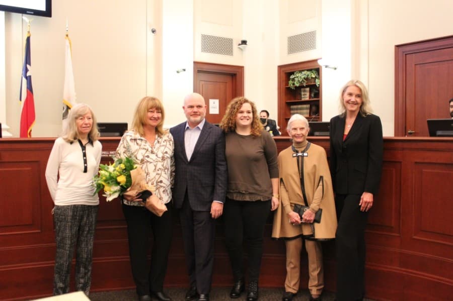 Kathy Talley poses with her family in the Southlake City Council Chambers on Nov. 17. (Sandra Sadek/Community Impact Newspaper)