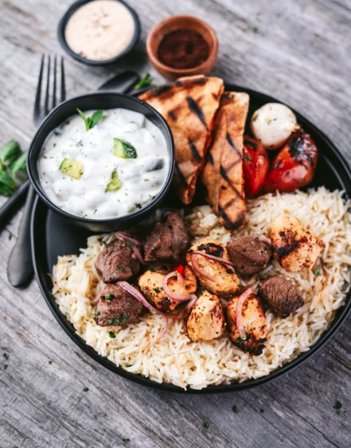 At the in-house food counter S Grill, customers can order the Beef Tenderloin Kebab and Shish Tawook entree ($16), which is made with Black Angus beef and marinated chicken tenders served with rice, pita and a choice of one side. (Courtesy Sara's Market & Bakery)