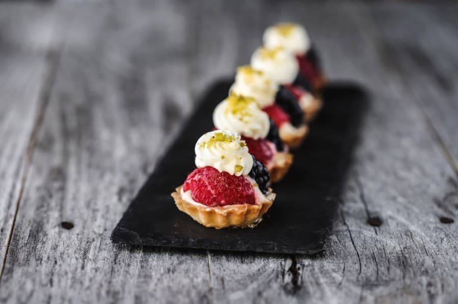 Mini fruit tarts ($1.75) are Sablé tart shell pastries made with Bavarian cream, organic fruit and apricot glaze. (Courtesy Sara's Market & Bakery)