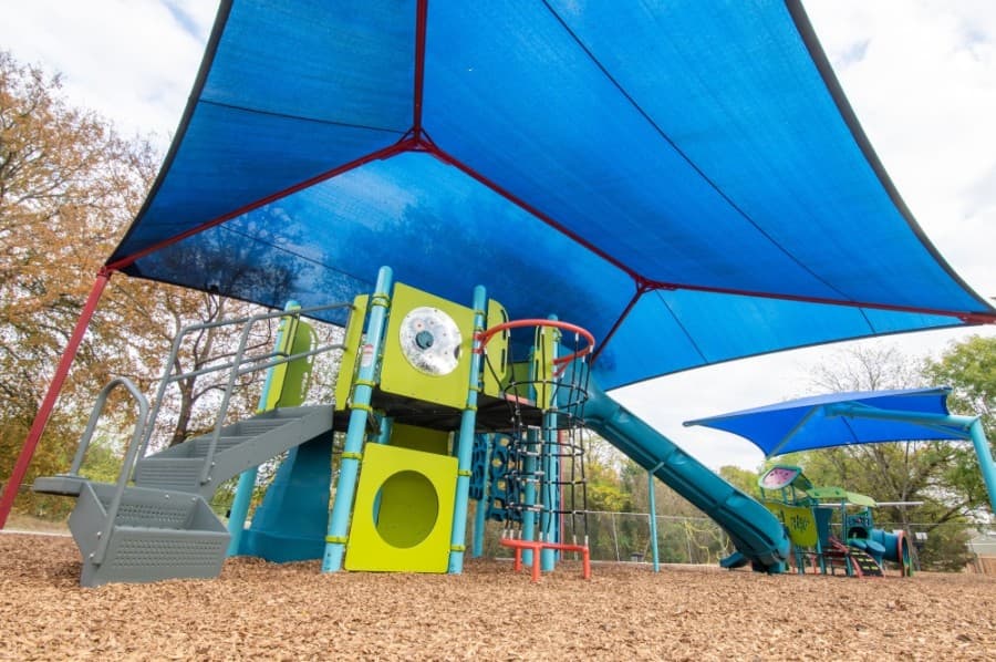 Creekside Park's renovated play space replaced 21-year-old equipment with a new play area for children ages 2-5 as well as one for ages 5-12 that includes swings and a shade structure. (Courtesy city of Pflugerville)