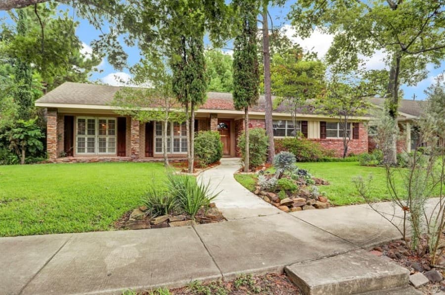 3530 Latma Drive, Houston: This 1955 ranch-style home sits on a corner lot with mature trees in Woodside. The home features an open floor plan that includes a living room/dining room combo along with a den that opens to a garden room. With its lot, this home is located near the Texas Medical Center, Brays Bayou and bike trail and convenient access to the I-610 Loop. 3 bed, 2 full baths/1,723 sq. ft. Sold for $325,001-$370,000 on Nov. 30. (Courtesy Houston Association of Realtors)
