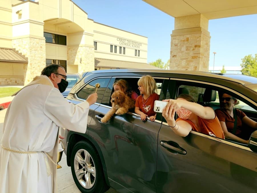 Father Sean Horrigan leads a drive-thru Blessing of the Pets event at Christ the Redeemer Catholic Church. (Courtesy Christ the Redeemer Catholic Church)