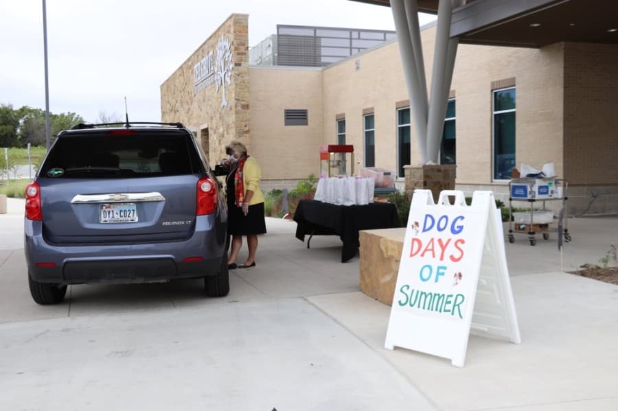 Staff at The Grove hosted a "Dog Days of Summer" drive-thru event for members earlier this year. (Courtesy Play Frisco)