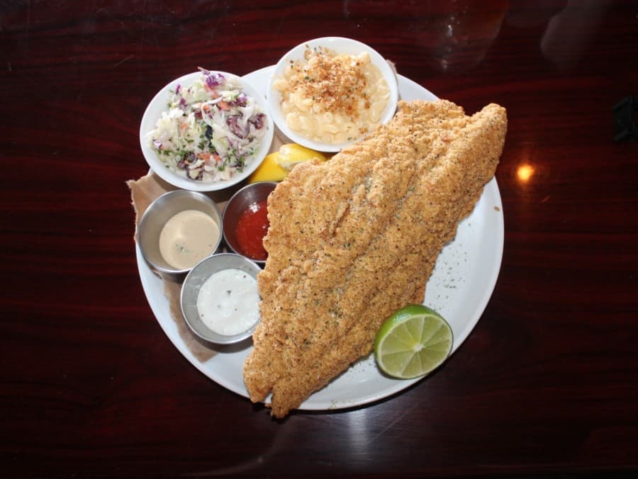 The fried Louisiana catfish ($15) comes with two sides, lemon slices, remoulade sauce, Creole tartar sauce and horseradish cocktail sauce.