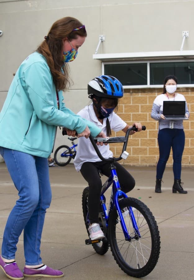 The electrical contracting company Weifield Group donated bicycles to students at a PfISD elementary School. (Courtesy Pflugerville ISD)