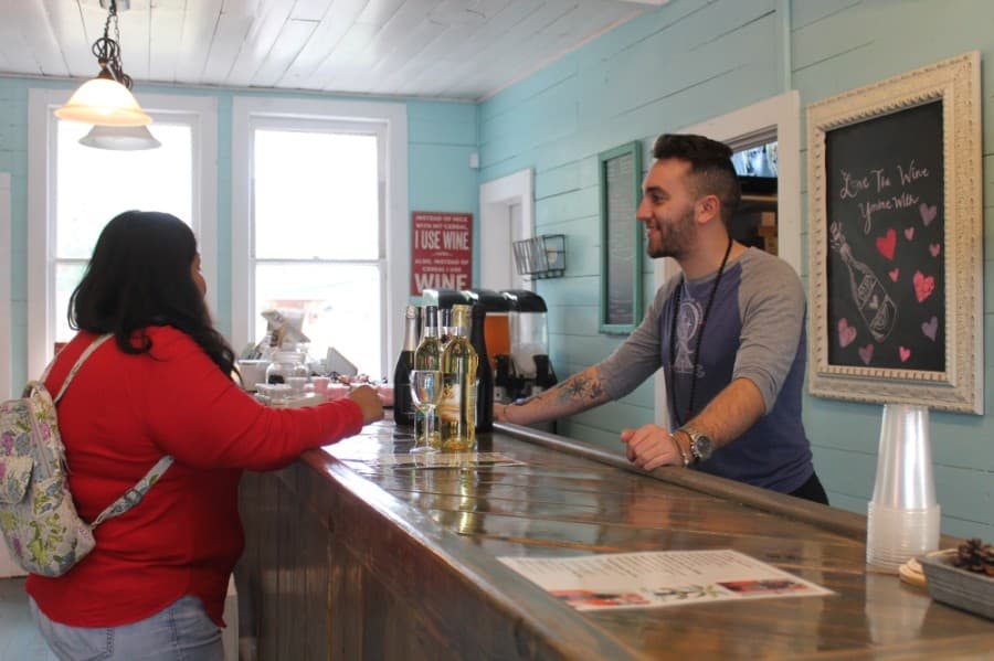 Colton Trout (right) bought the business from its previous owners in December 2019. (Colleen Ferguson/Community Impact Newspaper)