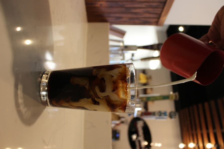 Honeylu’s cold brew is served with nitrogen gas, which creates small ripples in the drink. (Francesca D’Annunzio/Community Impact Newspaper)