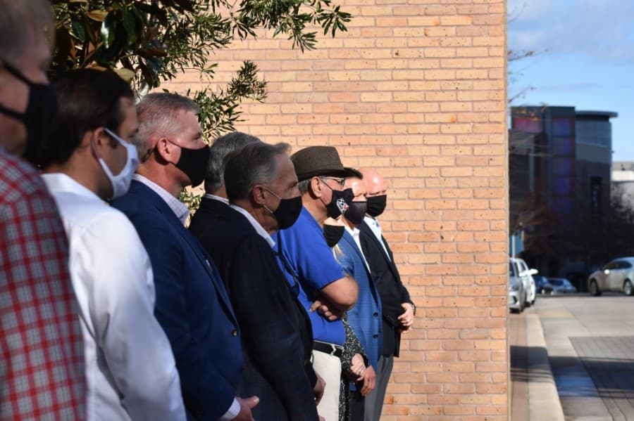 Onlookers, including local community and business leaders, lined the bridge at The Woodlands Waterway on Dec. 28 for the dedication ceremony. (Vanessa Holt/Community Impact Newspaper)