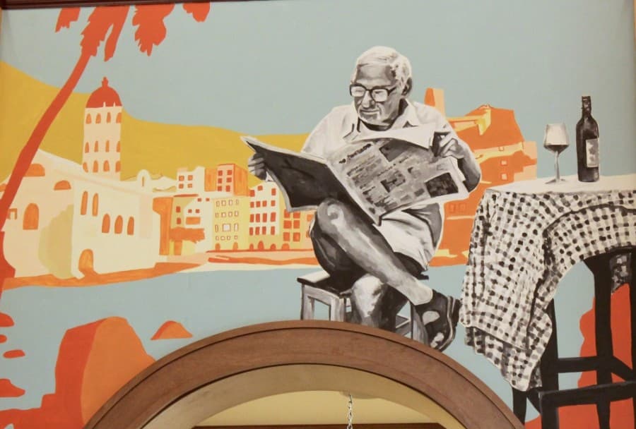 This mural is a nod to Harvest Hall itself. The background is reminiscent of Italy and emphasizes Harvest Hall's European-style food hall. (Sandra Sadek/Community Impact Newspaper)