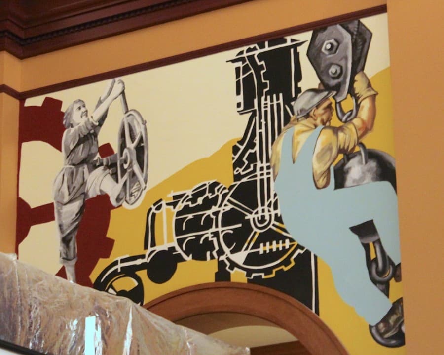 This first mural shows Grapevine's start during the industrial age and the Works Progress Administration, which was very important from the 1930s to the 1950s, according to artist Haylee Ryan. (Sandra Sadek/Community Impact Newspaper)