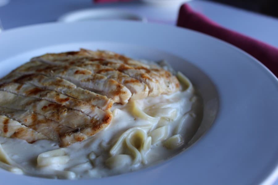 Chicken fettucini Alfredo:• Fettucini is served in a creamy housemade Alfredo sauce ($11) and can be topped with grilled chicken ($15) or grilled shrimp ($18). (Shawn Arrajj/Community Impact Newspaper)