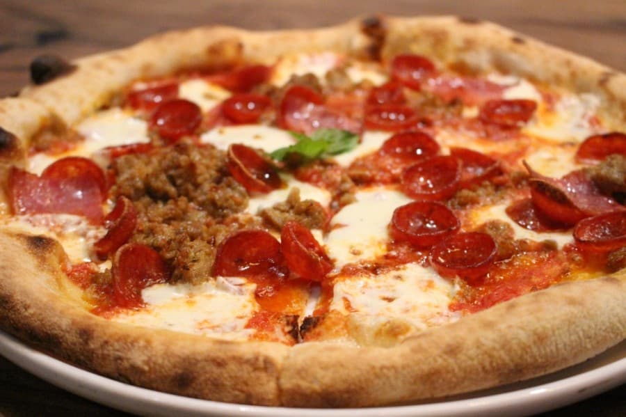 One of the restaurant's Italian-style pizzas is Neapolitan pork. ($17) (Andrew Christman/Community Impact Newspaper)