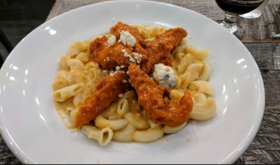 The Buffalo Mac N Cheese ($14) includes fried chicken strips, melted cheddar, buffalo sauce and bleu cheese crumbles.
