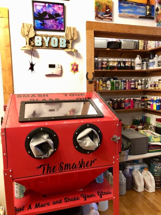 Creators can utilize "the smasher" to safely pummel glass bottles and use the pieces for art. (Sally Grace Holtgrieve/Community Impact Newspaper)