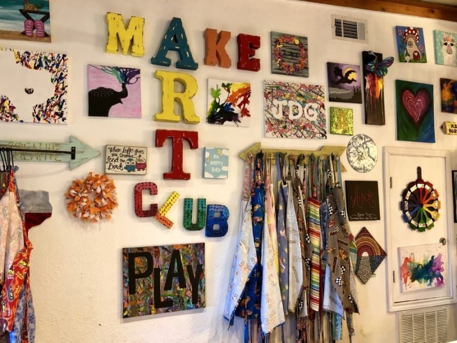 Projects cover the walls at Art Barn ATX. (Sally Grace Holtgrieve/Community Impact Newspaper)
