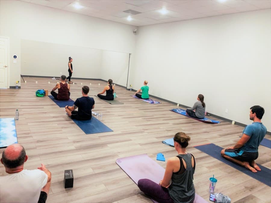 The studio features two rooms adjoined by a partition, which can be lifted to create a larger combined space. (Courtesy Roll Out Yoga)