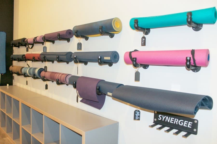 Prior to the ongoing coronavirus pandemic, Roll Out Yoga loaned complimentary yoga mats to its students. (Hannah Zedaker/Community Impact Newspaper)