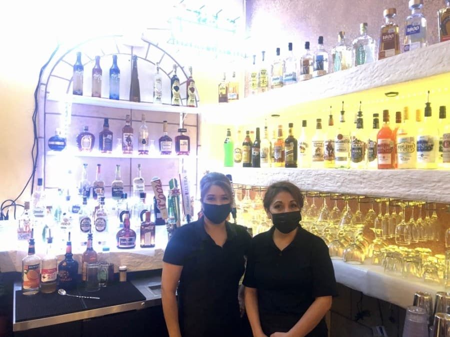 Owner Marisol Sanchez, right, and chef Aleida Rangel stand by the bar. (Sally Grace Holtgrieve/Community Impact Newspaper)
