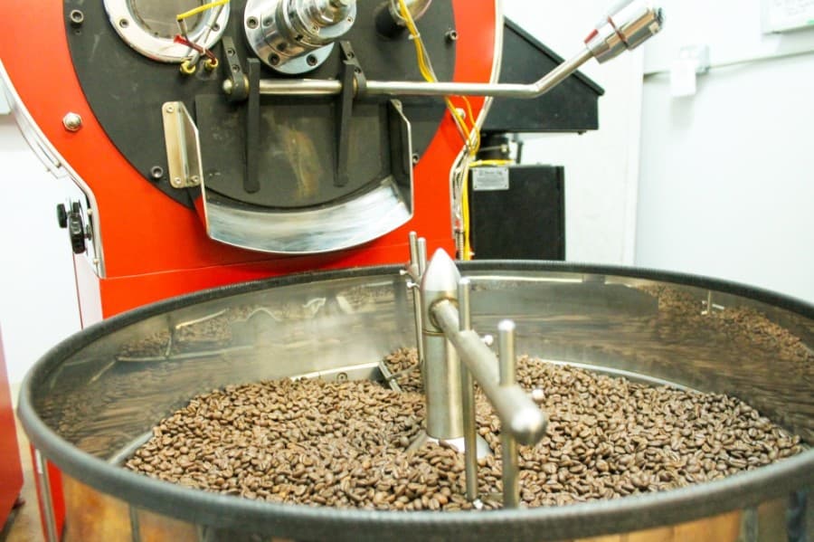 STEP 2: A machine roasts the beans in batches and removes the chaff, which is a papery skin surrounding the bean. (Andy Li/Community Impact Newspaper)