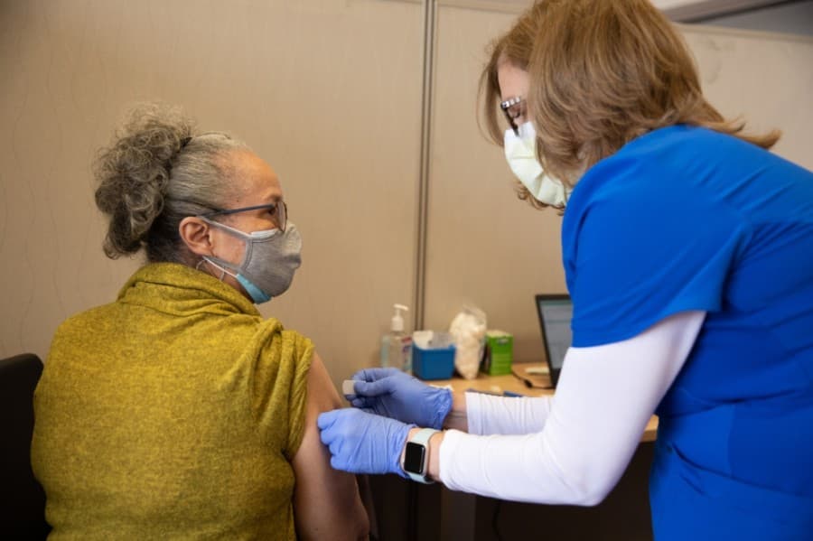 nurse giving vaccine