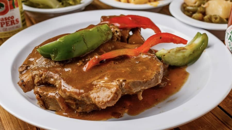 Smothered pork chops are available daily and come with three sides for $5.95. (Courtesy Craig Joseph)