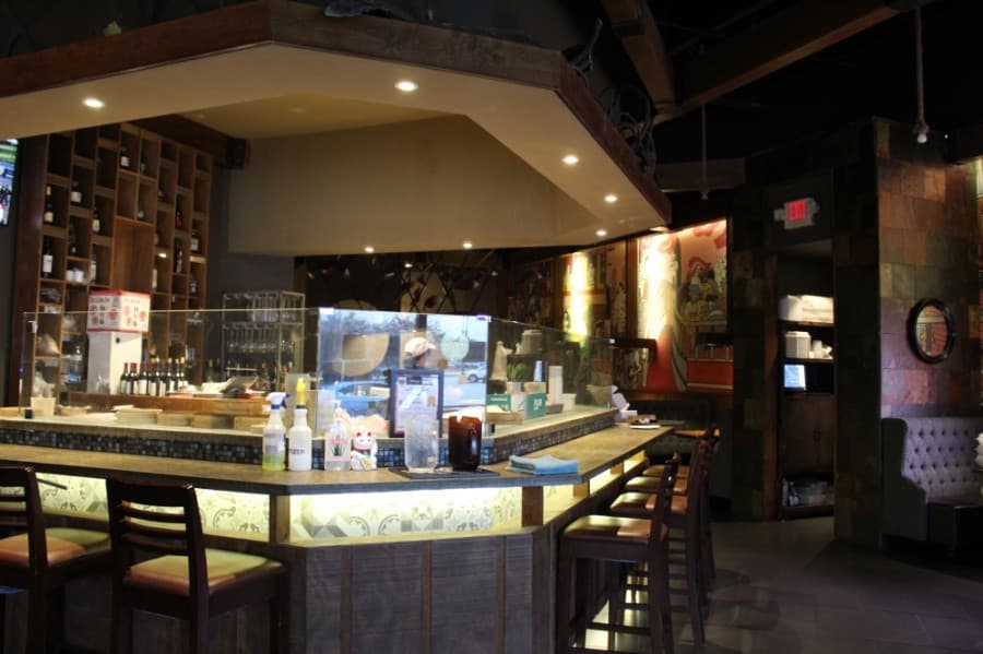 A dumpling bar at Duck N Bao allows customers to see their soup dumpling being made as they order them. (Shawn Arrajj/Community Impact Newspaper)