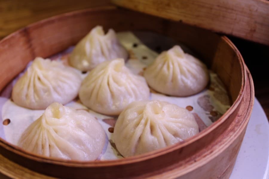 Pork soup dumplings ($8.95): Six seasoned pork filling and hot soup are prepared in a steamed dumpling. (Shawn Arrajj/Community Impact Newspaper)