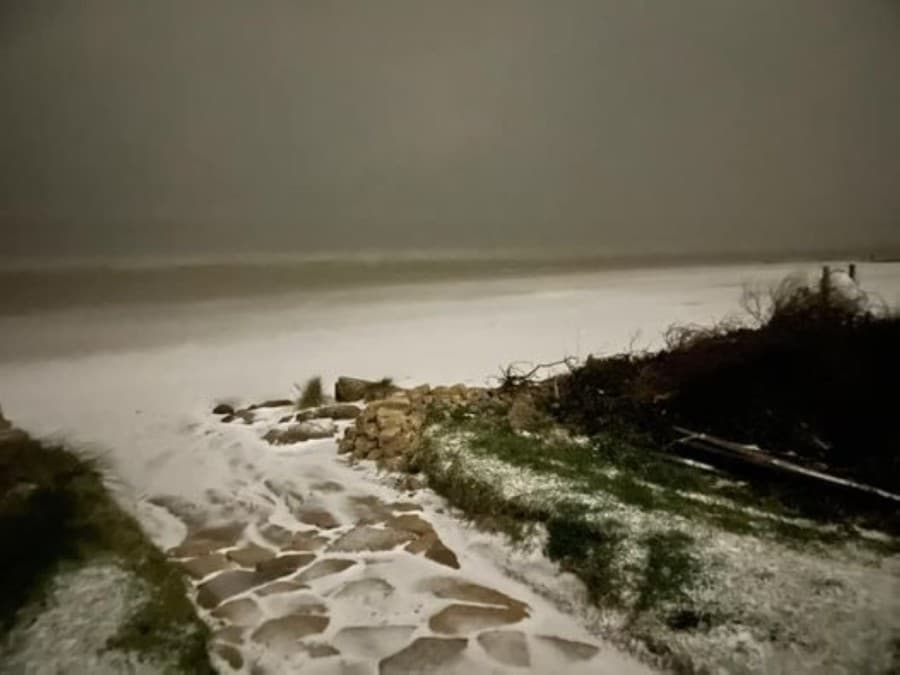 The shores of Seabrook's El Jardin Beach are snowy the morning of Feb. 15. (Courtesy Bradley Brown)