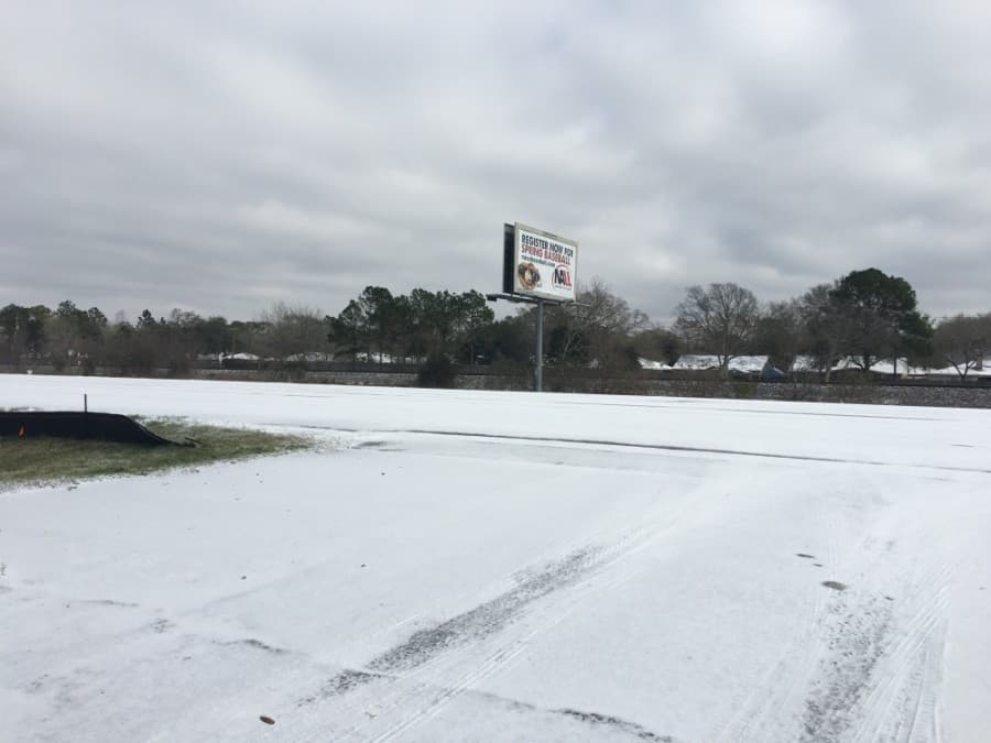 Snow is seen along Hwy. 3. (Haley Morrison/Community Impact Newspaper)