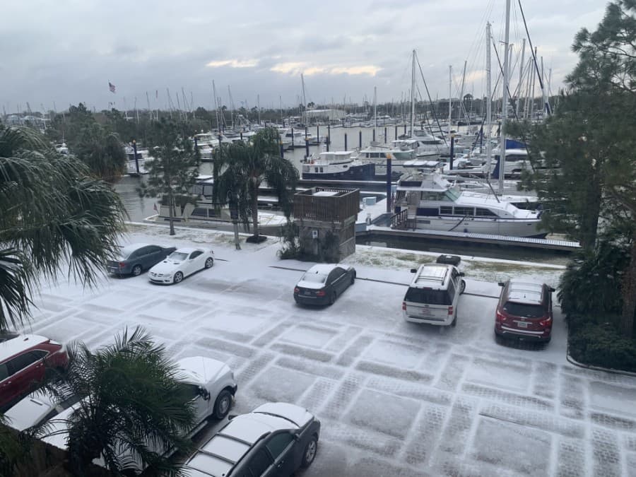 Cars were lightly blanketed in snow in Kemah the morning of Feb. 15. (Courtesy Jessica Holcomb)