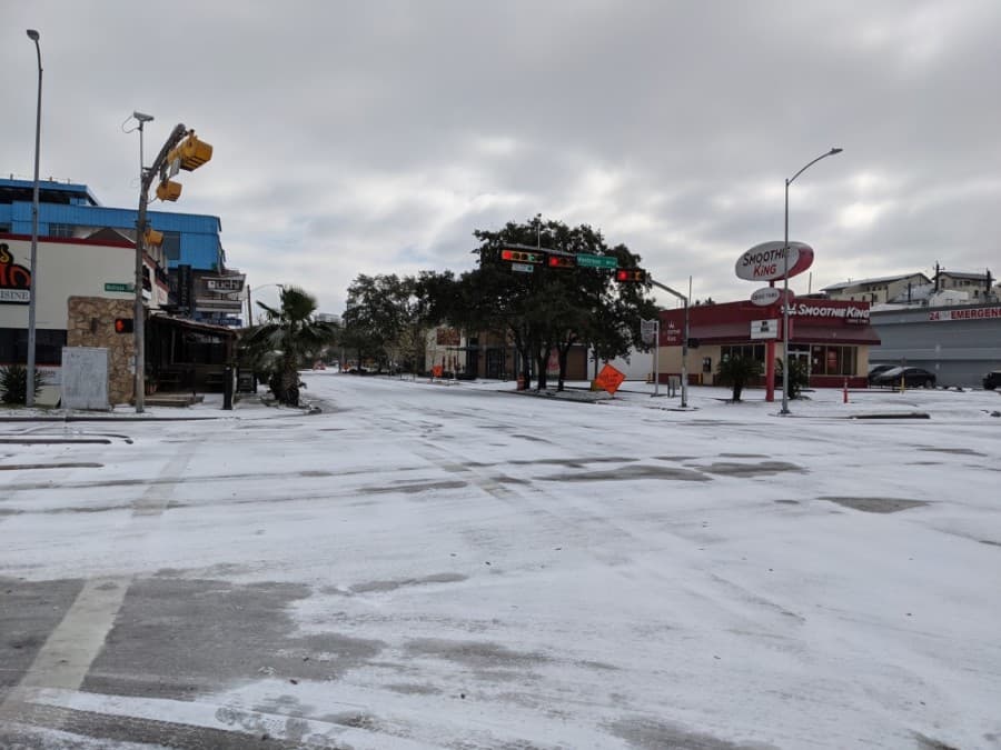 Westheimer Road and other roadways are impassable, stuck under a layer of ice and snow. (Jake MaGee/Community Impact Newspaper)