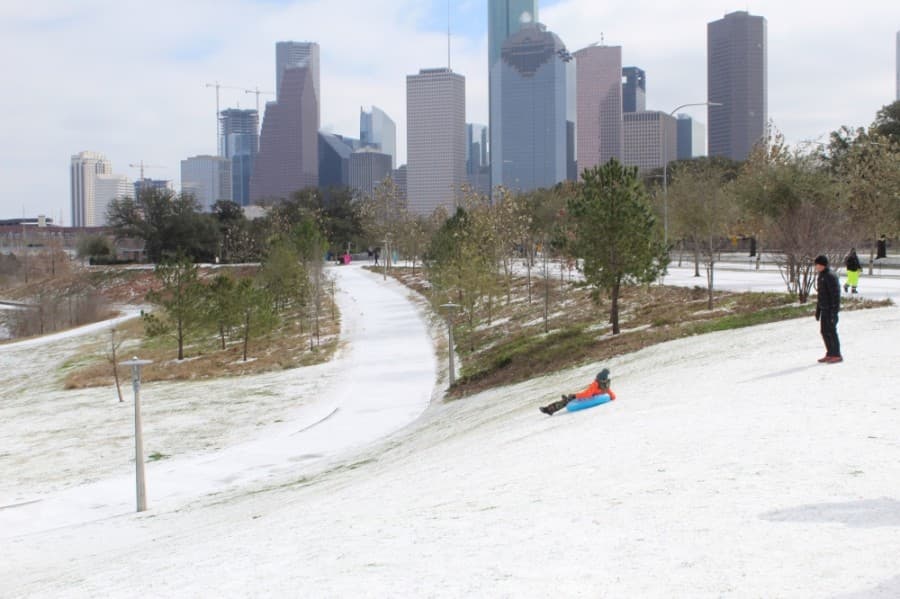 Parkgoers brought inner tubes to Buffalo Bayou Park for sledding