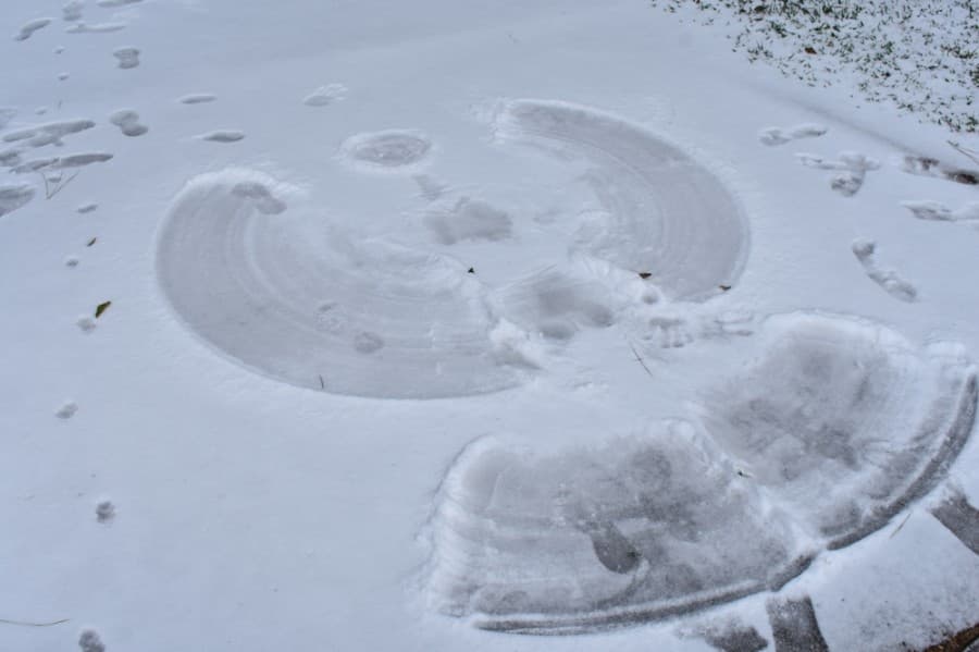 Children made snow angels in driveways of some Houston-area neighborhoods. (Vanessa Holt/Community Impact Newspaper)